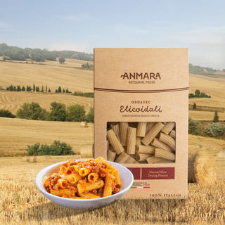 Anmara pasta box with a bowl of pasta in front of a scenic landscape